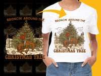 Load image into Gallery viewer, Broncin&#39; Around The Christmas Tree T-Shirt, Western Cowboy Holiday Tee, Rustic Christmas Casual Wear, Festive Graphic Shirt

